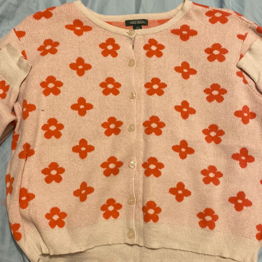This sweater may look big but it is a stretchy material so it can fit all sizes.